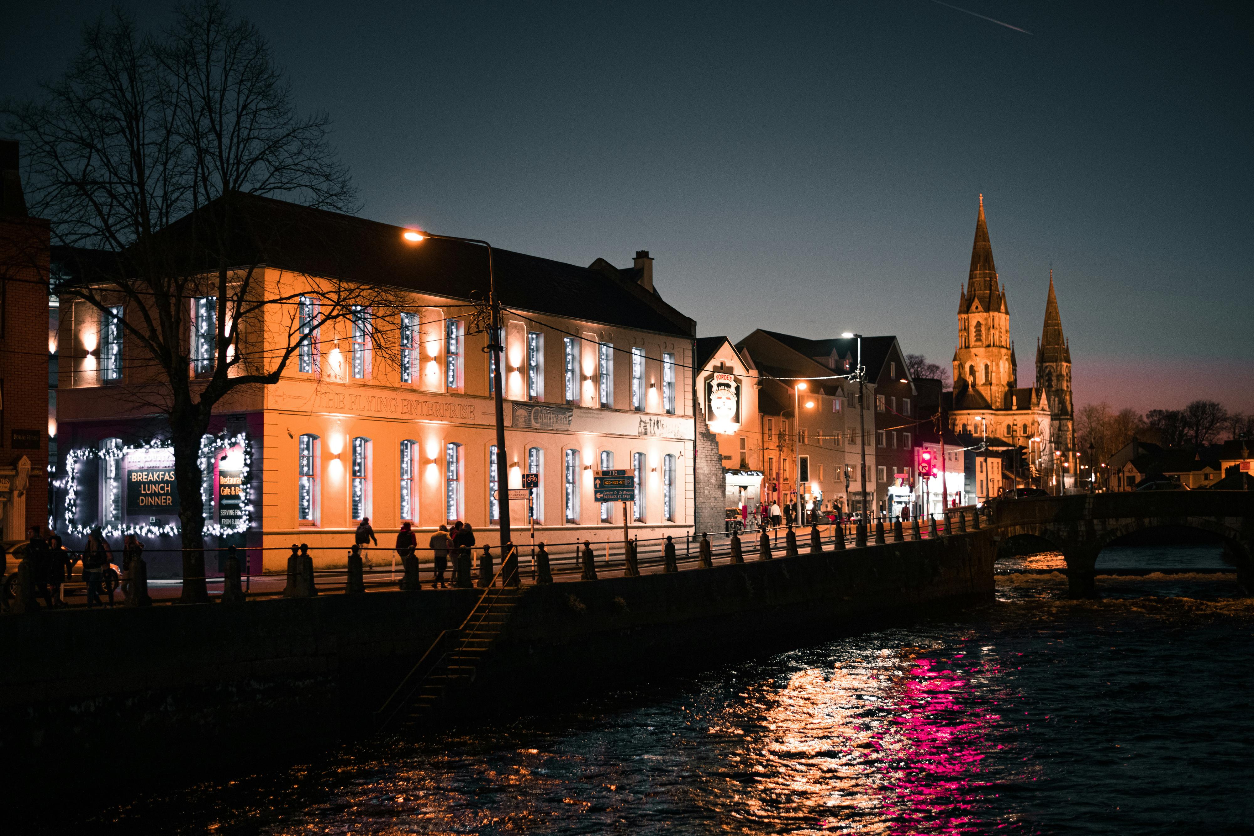The River Lea in Cork City lit up at night.