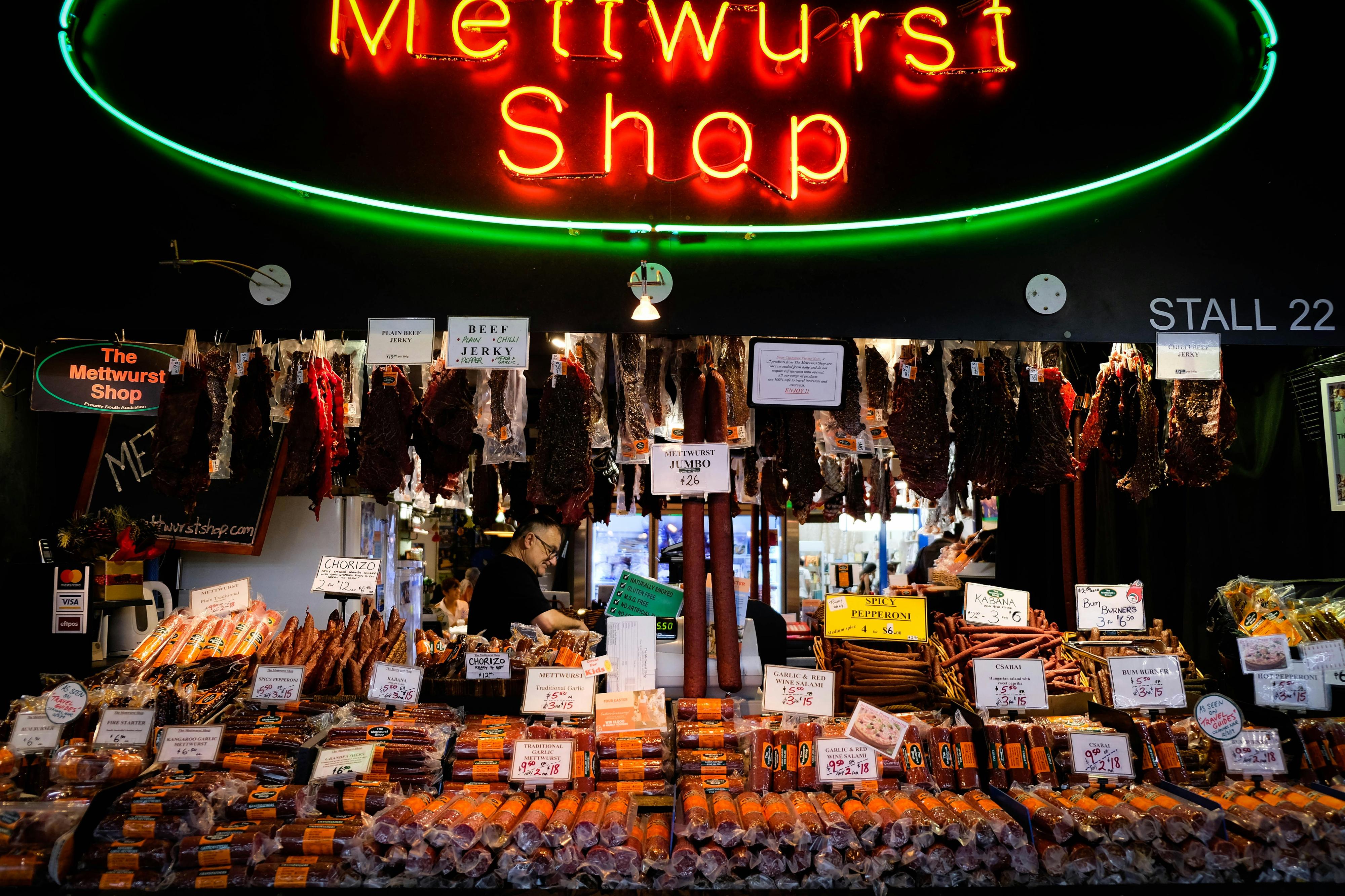 A food stall selling cured meats at Adelaide Central Market.