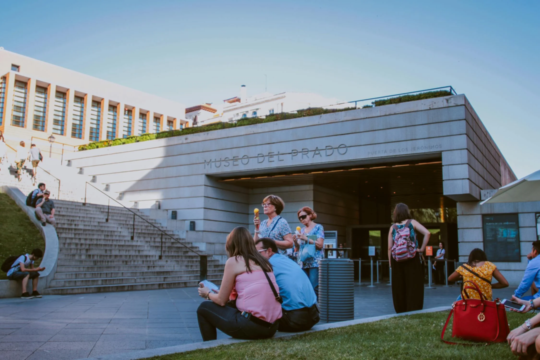 Tourists gather outside the Prado Museum
