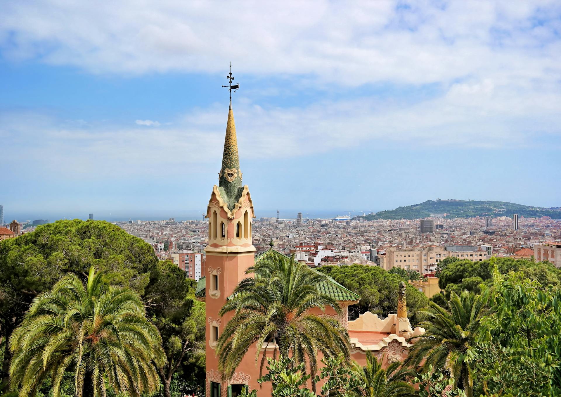 Church building with Barcelona skyline in the background.