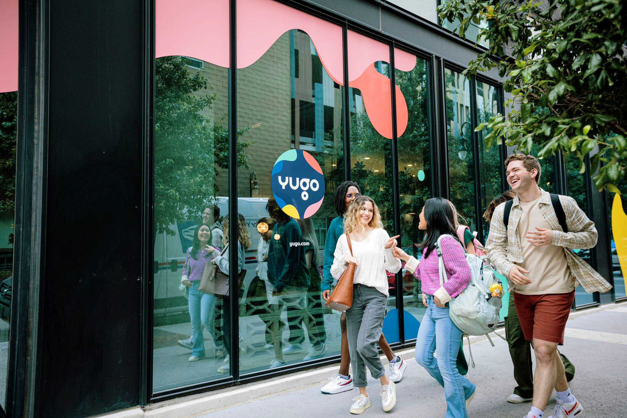 yugo students outside logo